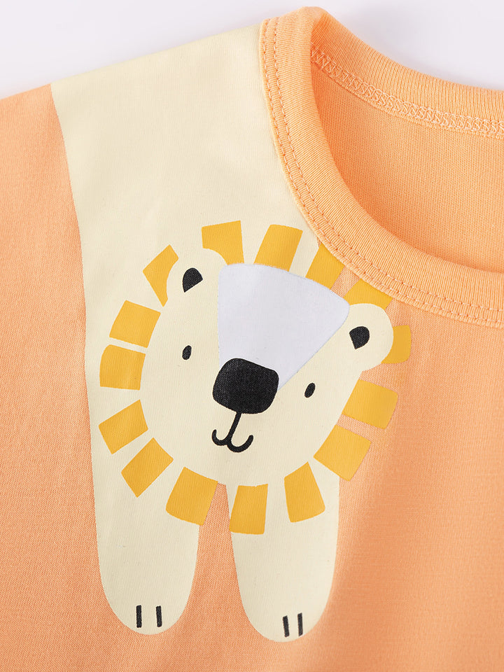 Children's shirt with a lion face design on an orange background