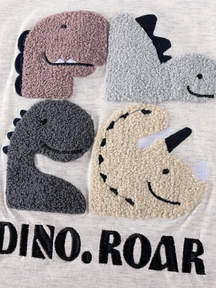 Close-up of colorful dinosaur graphic on heather gray kids t-shirt
