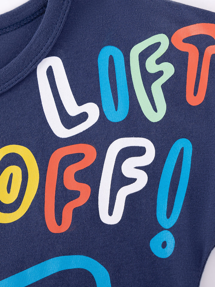 Close-up of colorful rocket graphic and Liftoff lettering on Caroagi navy kids t-shirt